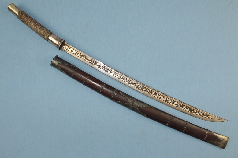 A fine Burmese Dah Silver dress Mid 19th century Status fighting sword Chinthe guardians to blade www.swordsantiqueweapons.com